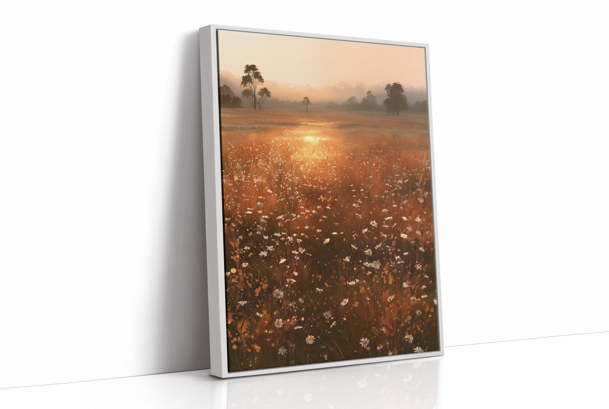 Where the Meadow Holds the Sun, a misty field of wildflowers and grass running toward a low sun, a line of dark trees at the horizon, painted in rust, amber and dusky plum, as a framed canvas in a white frame