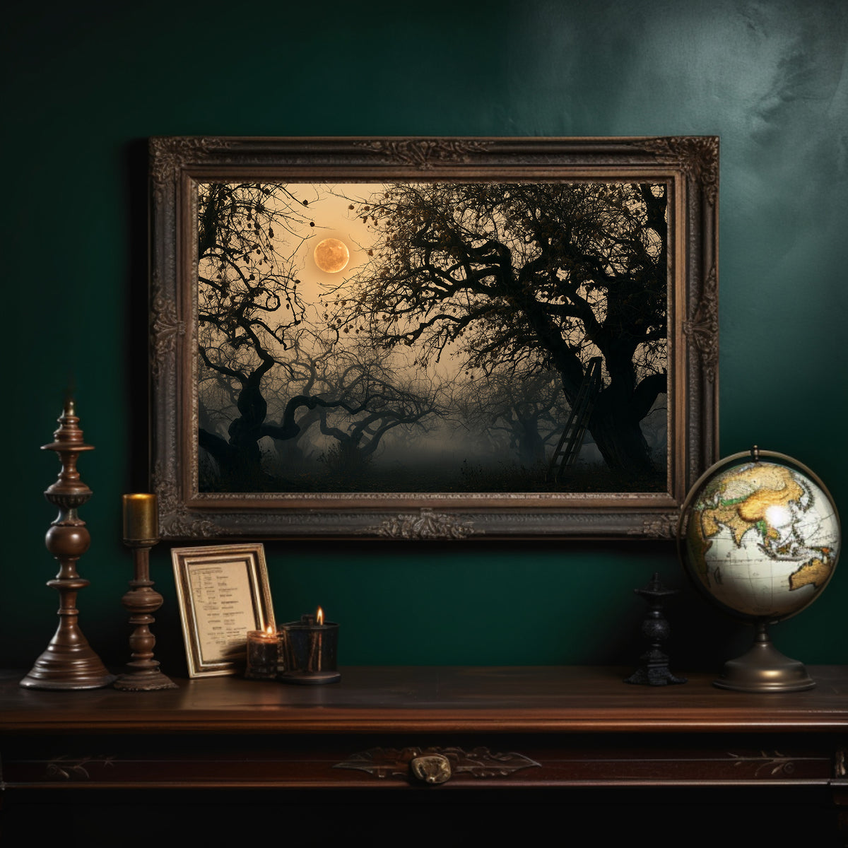Where the Old Oak Keeps Watch, a bare twisted tree silhouetted against an amber full moon above a misty dark forest, in an ornate dark frame on a deep green wall above a mantel with a globe and candles