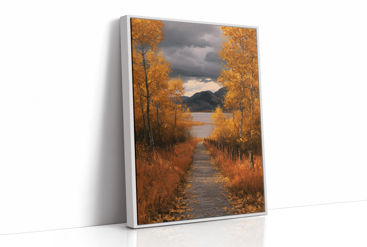 Where the Storm Lets Go of the Lane, a dirt lane between gold birches toward soft mountains under a clearing gray sky, painted in amber, slate and rust, as a framed canvas in a white frame