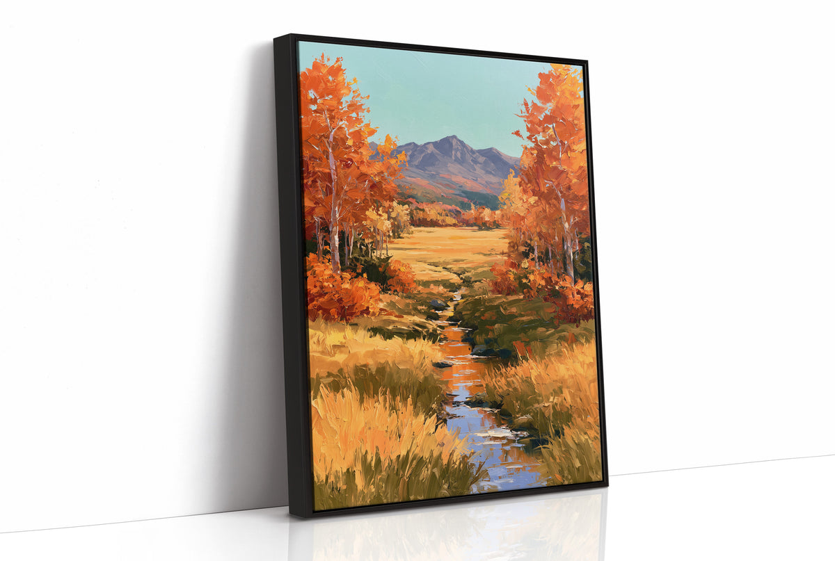 Where the Valley Turns Amber, an autumn valley of aspen trees in amber and rust beside a winding creek, with blue mountains and a pale sky above, painted in amber, rust and sky blue, as a framed canvas in a black frame