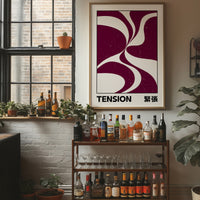 Where Two Curves Almost Touch, two maroon curved forms on a cream ground that lean toward each other and almost meet, with the word TENSION in black capitals and a small Japanese word beside it, in a wood frame on a brick wall above a bar cart of bottles and plants