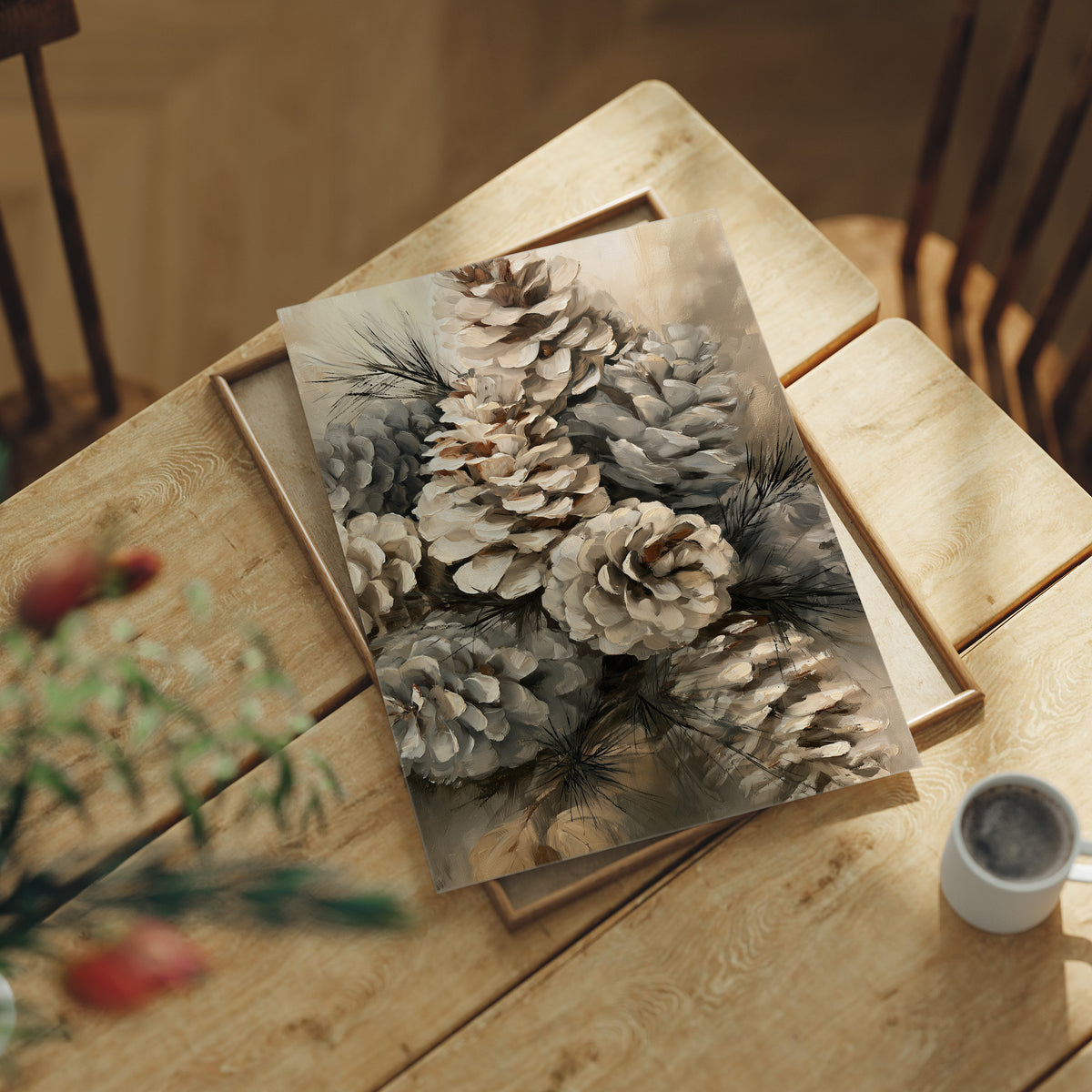 Winter Keeps Its Pine Cones, a cluster of pine cones on soft evergreen boughs, drawn in sepia, sage gray and warm bone with a natural history detail, lying flat on a light wood table beside a coffee cup and red berries