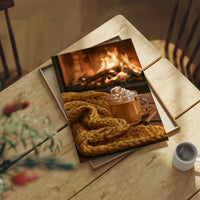 Hearth Of The Matter, print laid on a wooden table beside a white mug and flowers