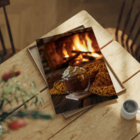 Cocoa Loco By The Fire, print laid on a wooden table beside a white mug and flowers