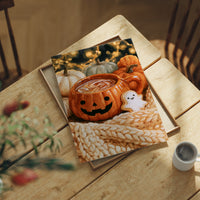 Snaggletooth Sips And Sweet Treats, print laid on a wooden table beside a white mug and flowers
