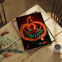 Glow Up, Grin Wide, Scare Hard, print laid on a wooden table beside a white mug and flowers