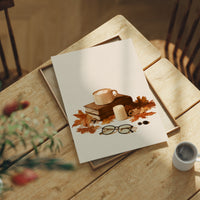 Brewed Awakening Between Chapters, print laid on a wooden table beside a white mug and flowers