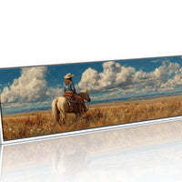 Cowgirl on Horse Overlooking Wide Western Prairie