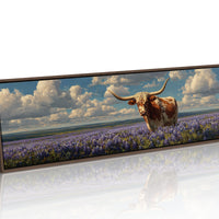 Texas Longhorn Standing in Blooming Bluebonnet Field