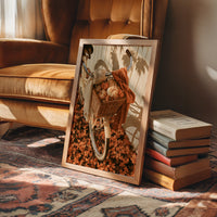 Gourd Delivery, Pedal Powered, framed print leaning on a leather armchair beside a stack of books