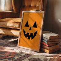 Face Value: Totally Gourd geous, framed print leaning on a leather armchair beside a stack of books