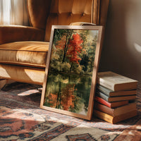 Mirror Mirror On The Pond, framed print leaning on a leather armchair beside a stack of books