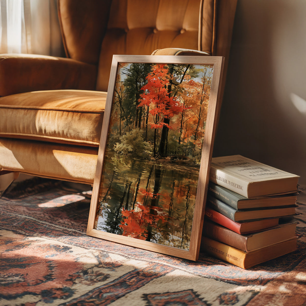 Seeing Red, Reflecting Well, framed print leaning on a leather armchair beside a stack of books