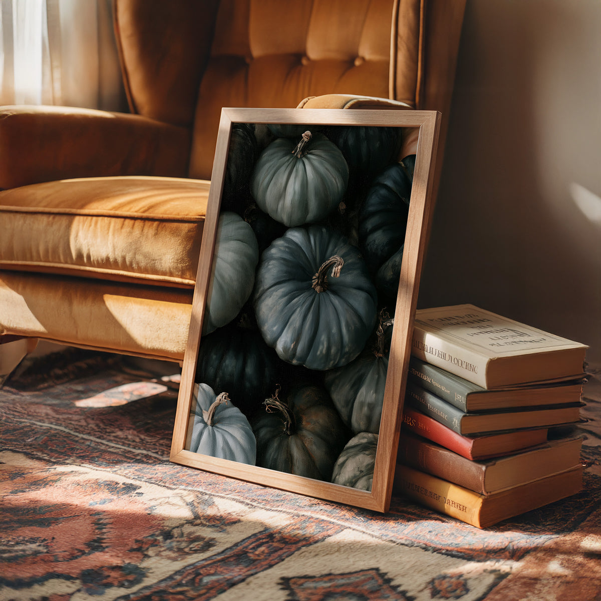 Feeling A Little Blue kin, framed print leaning on a leather armchair beside a stack of books