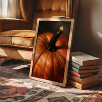 Stem Cell Of The Season, framed print leaning on a leather armchair beside a stack of books