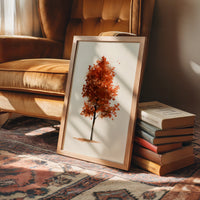 Solo Act, Standing Ovation, framed print leaning on a leather armchair beside a stack of books
