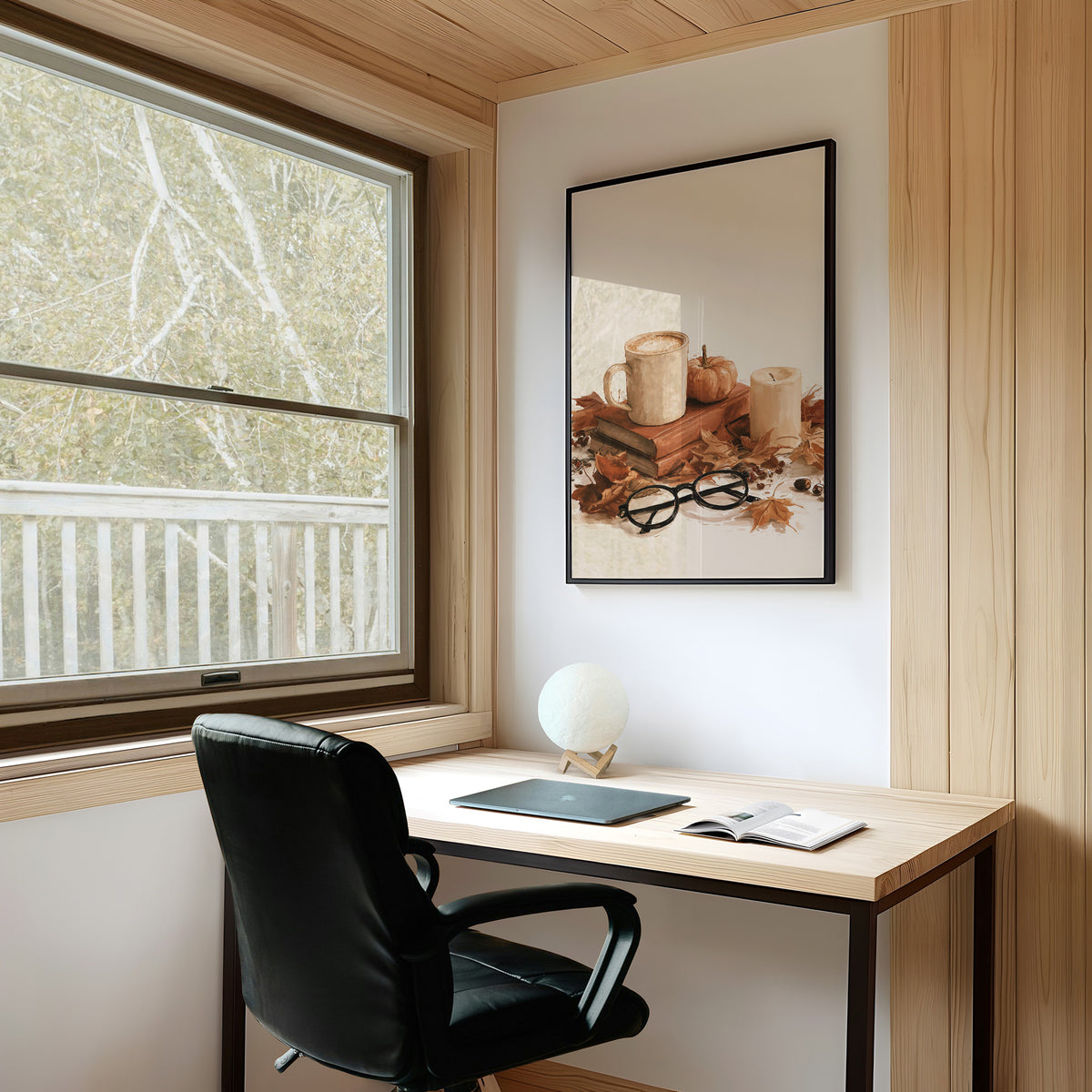 Read Between The Latte Lines, framed print on a white wall above a desk and black office chair