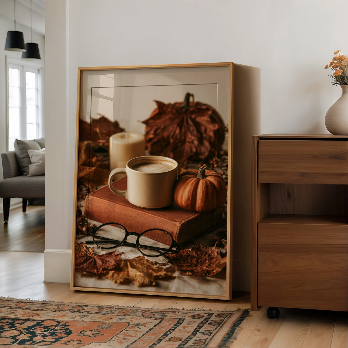 Novel Idea: More Coffee, large framed print leaning on a white wall beside a wood cabinet