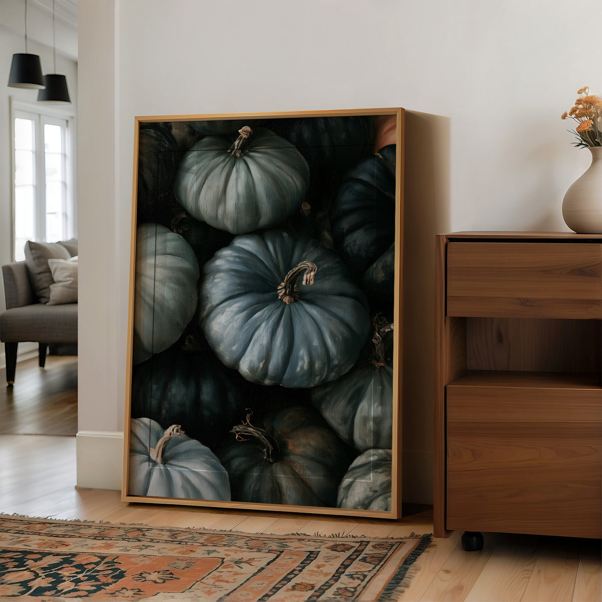 Feeling A Little Blue kin, large framed print leaning on a white wall beside a wood cabinet