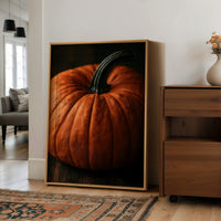 Speckled, Ribbed, And Ready For Its Portrait, large framed print leaning on a white wall beside a wood cabinet