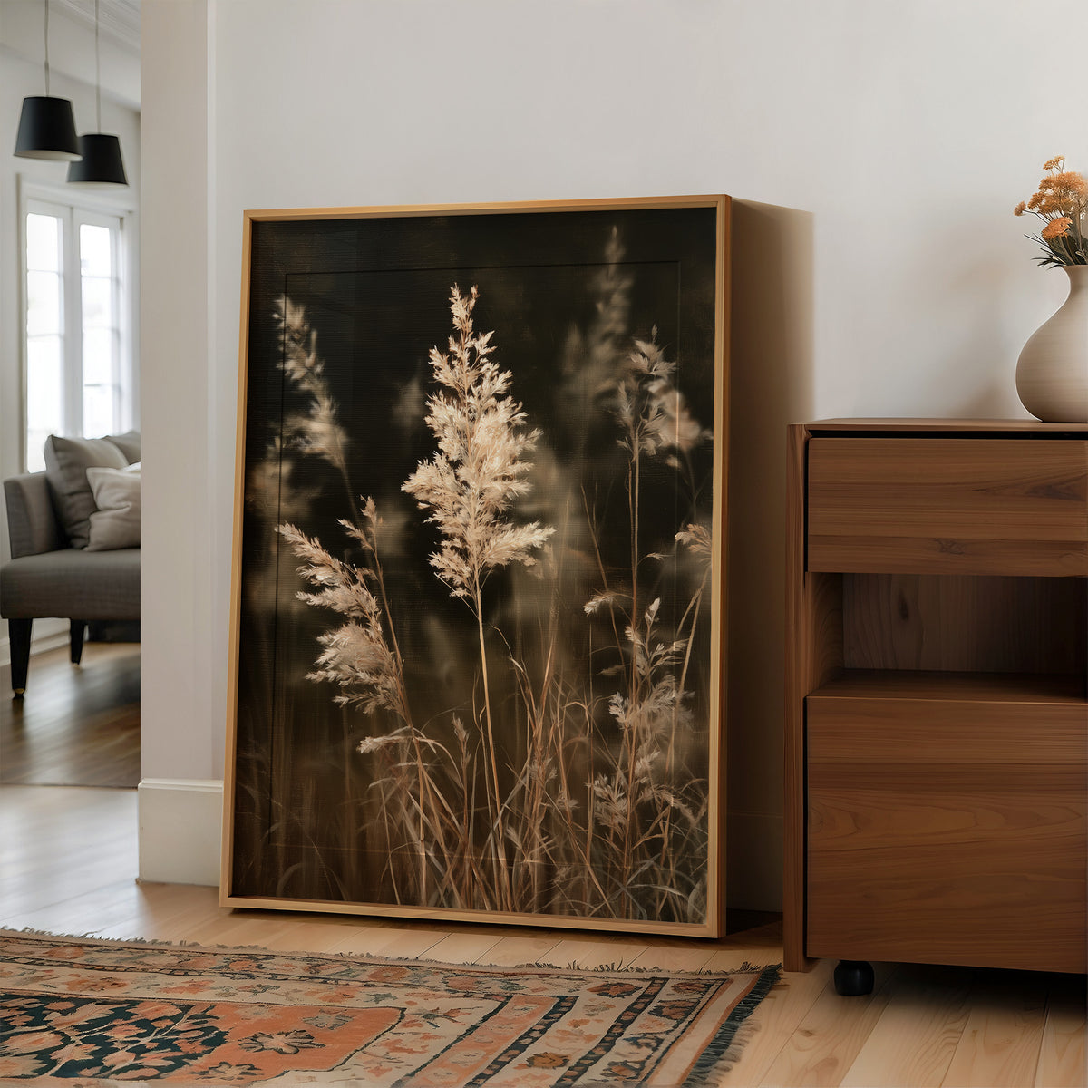 Plume With A View, large framed print leaning on a white wall beside a wood cabinet