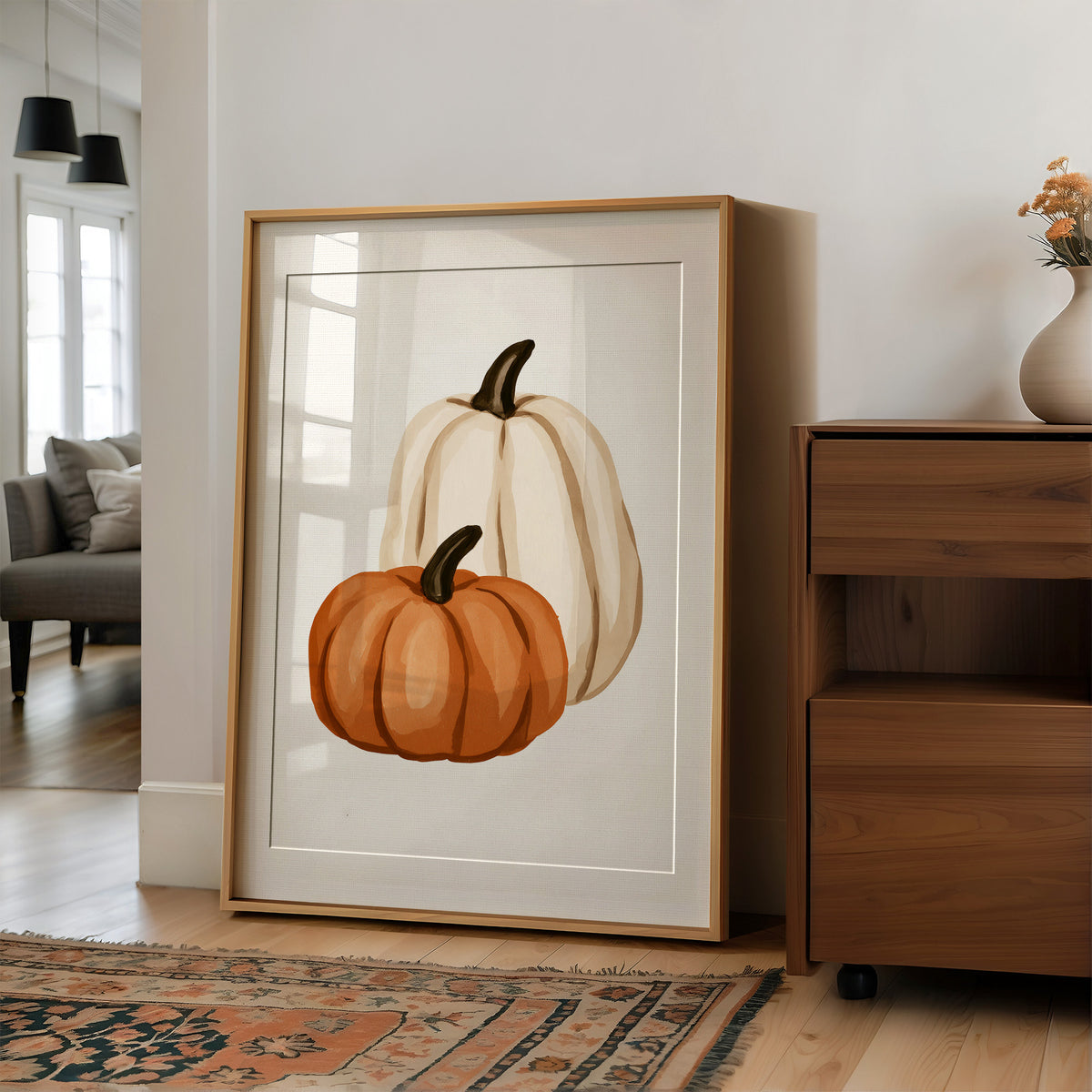 Short Stack, Long Shadow, large framed print leaning on a white wall beside a wood cabinet
