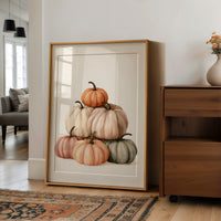 Pastel Pyramid Scheme, large framed print leaning on a white wall beside a wood cabinet