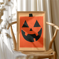 It’s Hip To Be Square, framed print resting on a wooden chair beside sheer curtains
