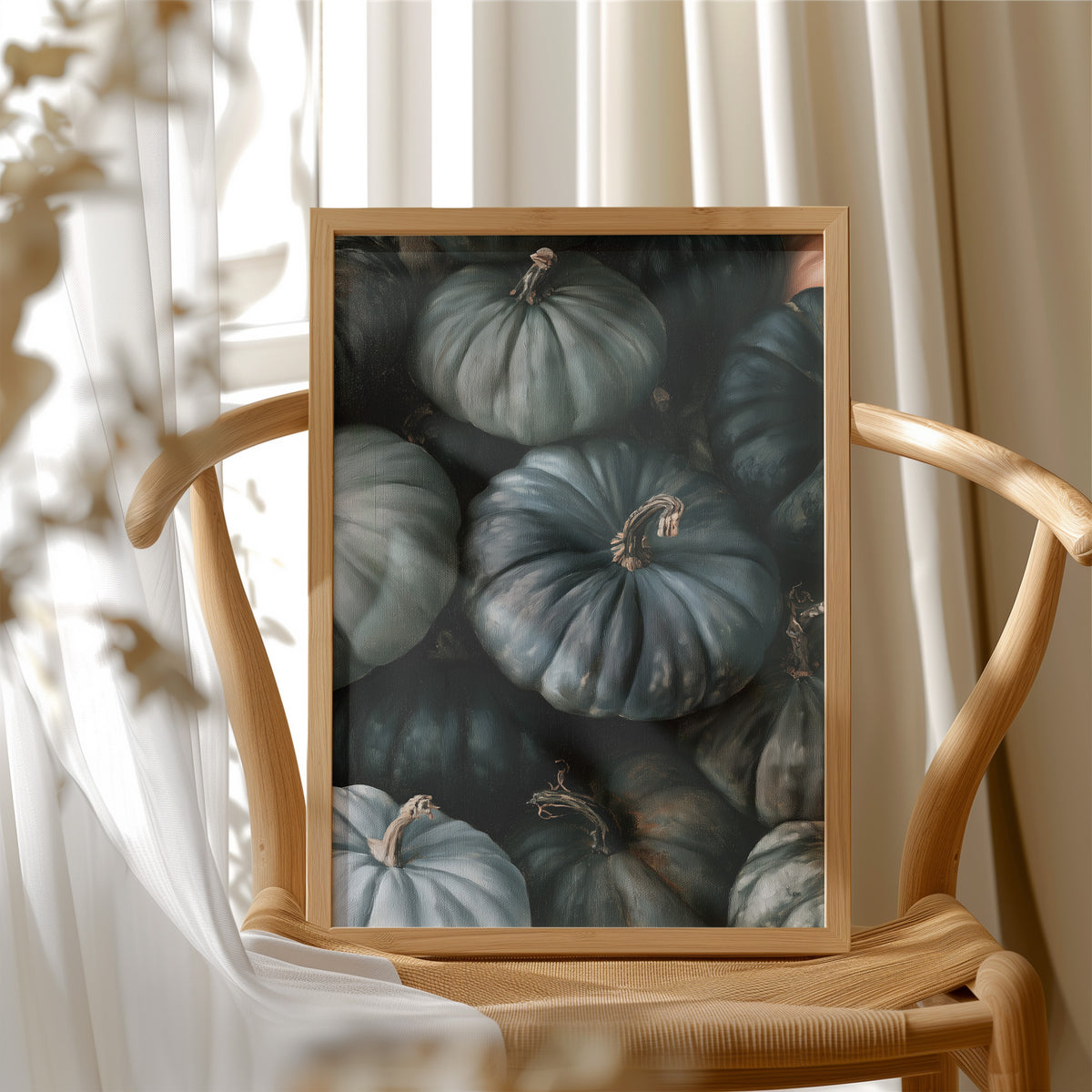 Feeling A Little Blue kin, framed print resting on a wooden chair beside sheer curtains