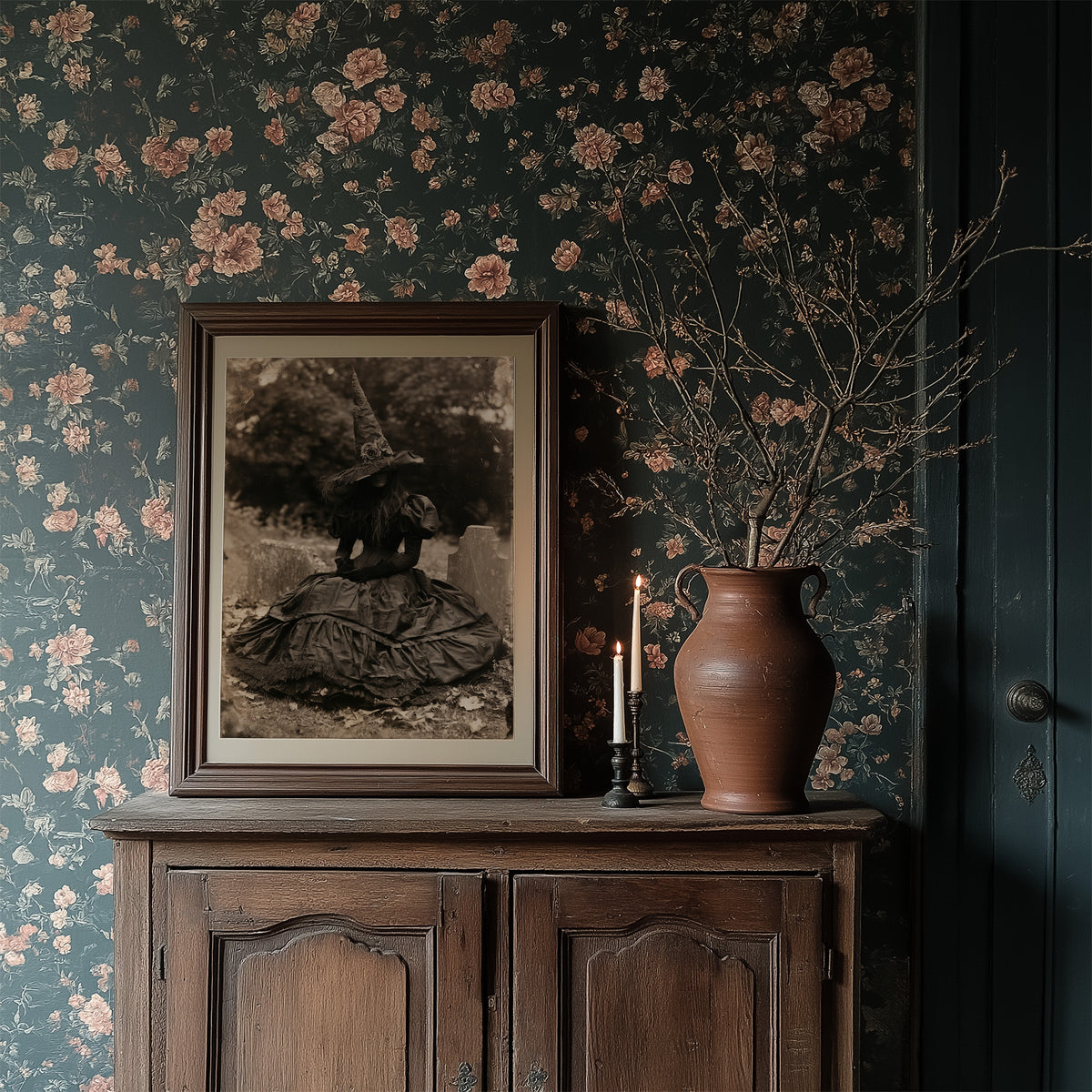 Resting Witch Face, framed print resting on a wooden chair beside sheer curtains