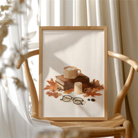 Brewed Awakening Between Chapters, framed print resting on a wooden chair beside sheer curtains