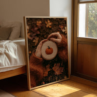 Hoop Dreams, Pumpkin Edition, framed print leaning beside a bed in a sunlit bedroom