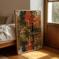 Seeing Red, Reflecting Well, framed print leaning beside a bed in a sunlit bedroom