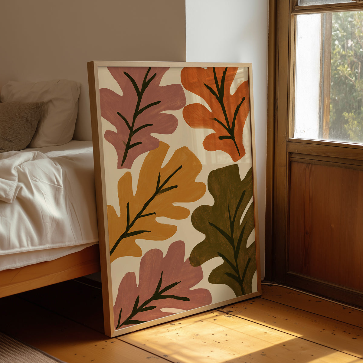 Big Leaf Energy, framed print leaning beside a bed in a sunlit bedroom