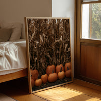 Lineup At The Corn Maze, framed print leaning beside a bed in a sunlit bedroom
