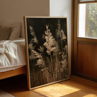 Plume With A View, framed print leaning beside a bed in a sunlit bedroom